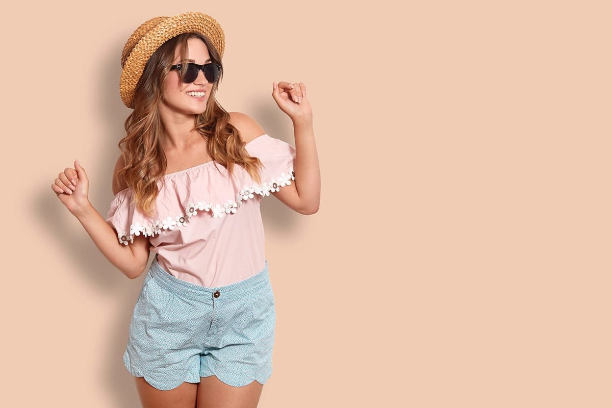 adorable female in summer clothing, has positive expression